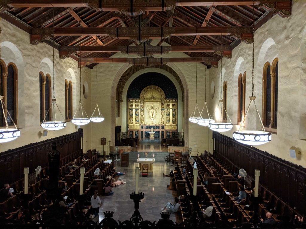 A cohort of Catholic missionaries mystically praying at Church.