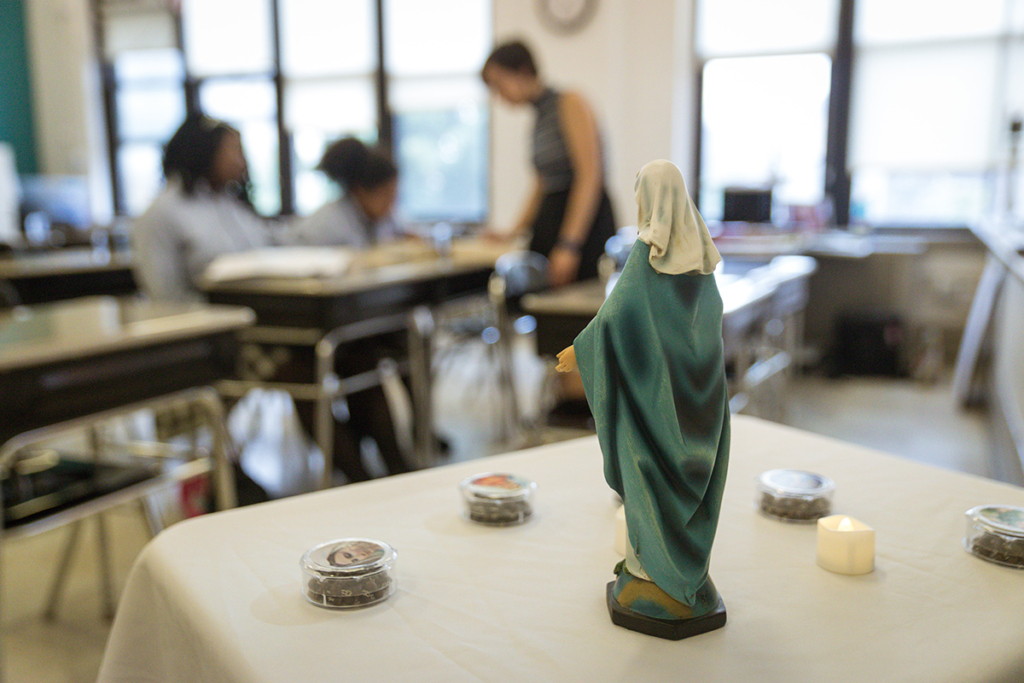 A Marian statue and rosaries in an El Camino classroom